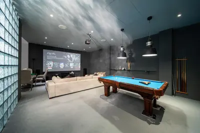 a living room with a pool table and a tv at Villa Serenity -30 meter Pool & 6 Bedroom with Cinema Room and Gym in Ko Lek