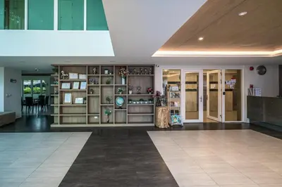 a lobby of a building with a lot of shelves at Mountain view apartment near Kata beach in Kata Beach