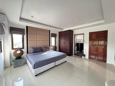 a bedroom with a large bed in a room at The President Park Condo Nanai, Patong, Phuket in Patong Beach