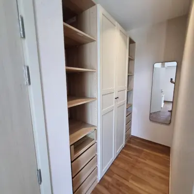 a walk in closet with white cabinets and a mirror at Title Halo Nai Yang Тайтл Хало Най Янг operated by OK Group in Nai Yang Beach