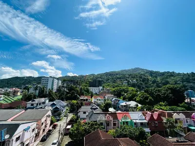 an aerial view of a city with buildings and trees at APK Hillview Hotel in Patong Beach