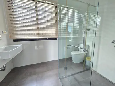 a bathroom with a glass shower and a toilet at Laguna Park 2 Villa 3 bedroom in Ban Phru Champa