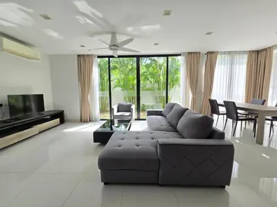 a living room with a couch and a table at Laguna Park 2 Villa 3 bedroom in Ban Phru Champa