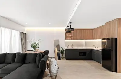 a living room with a couch and a kitchen at Laguna Lakeside BangTao Лагуна Лейксайд Lagoona operated by OK Group in Bang Tao Beach