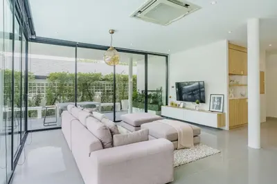 a living room with a couch and two chairs at Harmony Exclusive Villa Bang Tao Phuket in Ban Thalat Choeng Thale