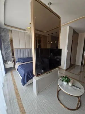 a bedroom with a large mirror and a bed at Bellevue Lagoon Phuket 212 Bang tao operated by OK Group in Laguna Phuket
