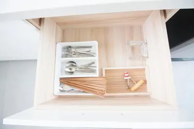 a wooden open drawer with tools in it at Spacious 2 Bedrooms 360deg Mountain-View Apartment in Ban Klang