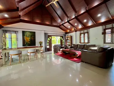 a living room with leather furniture and a table at Kata Tropical Heights Villa - 4BR Private Pool in Kata Beach