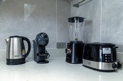 a blender and a coffee maker on a counter at Beachside 1 bedroom apartment 200 meters to Bang Tao Beach Manage by OCEAN HUB in Ban Thalat Choeng Thale