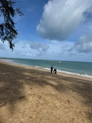 a couple of people standing on the beach at Coco Calm Title Halo 1 in Koh Lone