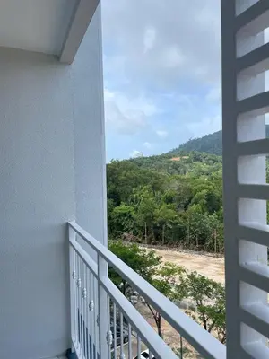 a balcony with a view of a mountain at Coco Calm Title Halo 1 in Koh Lone