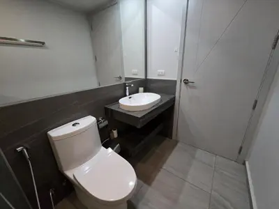 a bathroom with a white toilet and a sink at Easy Stay – 2-Bedroom T2-618 in Phuket Town