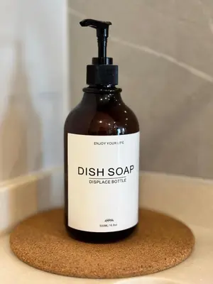 a bottle of dish soap sitting on a sponge at New Stylish Cozy One-bedroom Apartment in Bangtao, Phuket, Near EDC in Ban Thalat Choeng Thale