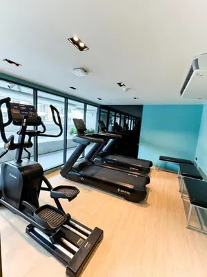 a gym with three exercise bikes in a room at New Stylish Cozy One-bedroom Apartment in Bangtao, Phuket, Near EDC in Ban Thalat Choeng Thale