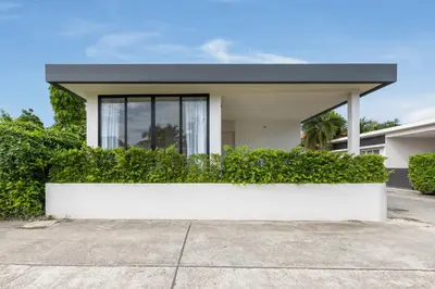 a white house with a black roof at Villa Noa Modern 2-Bedroom with Private Pool in Rawai Beach