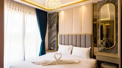 a bedroom with a swan decoration on a bed at Apartment studio in Bellevue Lagoon on Bang Tao in Laguna Phuket