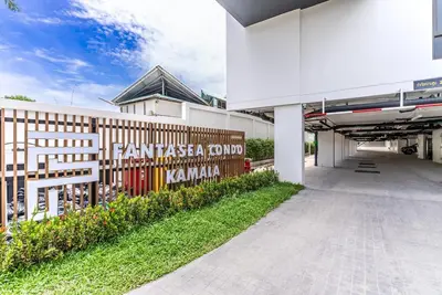 a building with a sign on the side of it at Fantasea by Villacarte in Kamala Beach