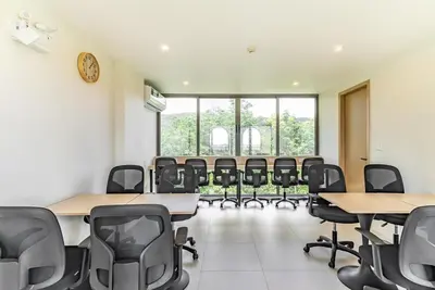 a classroom with desks and chairs in a room at Fantasea by Villacarte in Kamala Beach