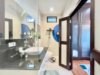 a bathroom with a sink and a toilet at MYSA House Pool Villa Central Phuket in Phuket