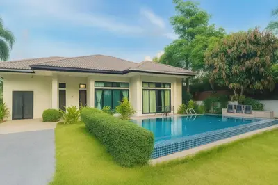 a house with a swimming pool in the yard at MYSA House Pool Villa Central Phuket in Phuket
