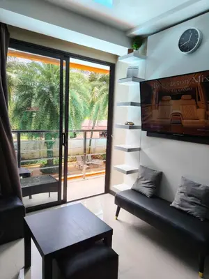 a living room with a couch and a table at Lux apartment Mai Khao beach in Mai Khao Beach