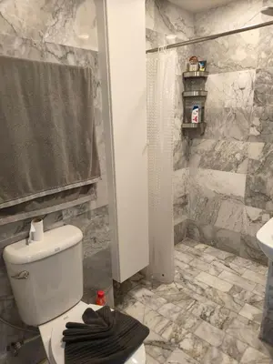 a bathroom with a toilet and a shower and a sink at Lux apartment Mai Khao beach in Mai Khao Beach