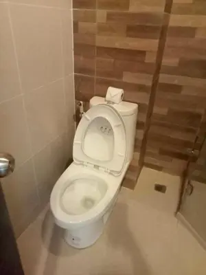 a bathroom with a toilet with the seat up at XX GO Inn Krabi Aonang Beach - โกอินน์ อ่าวนาง in Ban Khlong Haeng