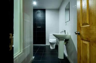 a bathroom with a white toilet and a sink at XX GO Inn Krabi Aonang Beach - โกอินน์ อ่าวนาง in Ban Khlong Haeng