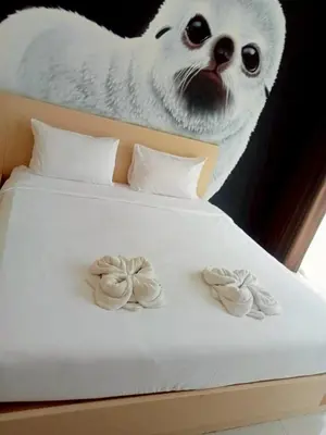 a bed with a picture of a polar bear at XX GO INN Aonang Beach - หาดอ่าวนาง กระบี่ in Ban Khlong Haeng