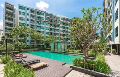 an image of a swimming pool in a building at cen 1 bed room862 in Ban Rangeng