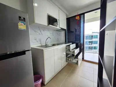 a small kitchen with a sink and a refrigerator at cen 1 bed room862 in Ban Rangeng