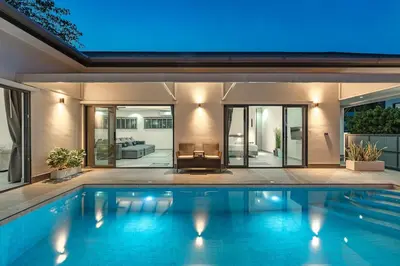 a swimming pool in the backyard of a house at V162 Super Modern Brand New Stunning Design in Rawai Beach