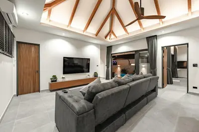 a living room with a large couch and a flat screen tv at V162 Super Modern Brand New Stunning Design in Rawai Beach