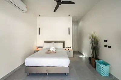 a bedroom with a bed with a teddy bear on it at V162 Super Modern Brand New Stunning Design in Rawai Beach
