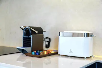a coffee maker sitting on top of a counter at Lerka Villa Elegant 3 Bedroom in Rawai Beach