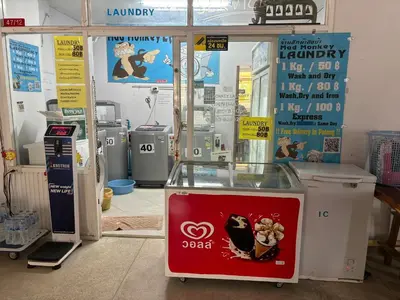 a shop with a claw machine with a sign on it at Monkey Apartment 3 in Patong Beach