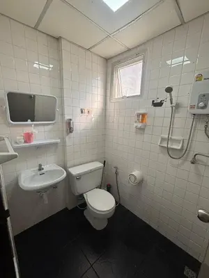 a bathroom with a toilet and a sink at Monkey Apartment 3 in Patong Beach