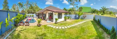 a house with a pool in a yard at Serenity Holiday Pool Villa, Bangtao Beach in Surin Beach