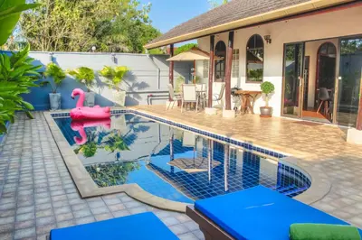 a swimming pool with a pink flamingo in a house at Serenity Holiday Pool Villa, Bangtao Beach in Surin Beach