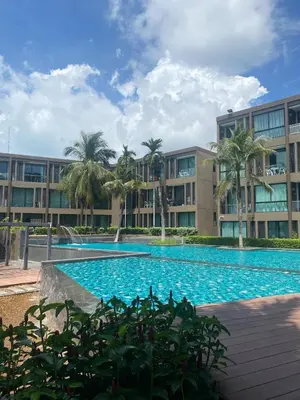 a large swimming pool in front of a building at Phuket, The Pixcel Cape Panwa Condo in Ban Ao Makham