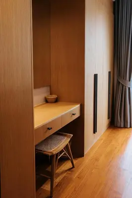 a wooden cabinet with a bench and a chair in a room at Botanic Modern loft Villa Private Pool 10 min BangTao in Ban Pak Lak