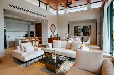 a living room with a couch and a table at Botanic Modern loft Villa Private Pool 10 min BangTao in Ban Pak Lak