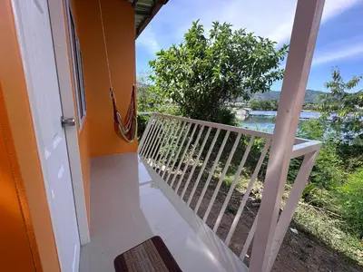 a balcony with a view of the water at Pangea Stay in Kathu