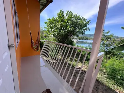 a balcony with a view of the water at Pangea Stay in Kathu
