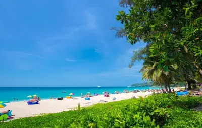 a beach with a crowd of people and the ocean at New studio near Boat Avenue by Lofty in Bang Tao Beach