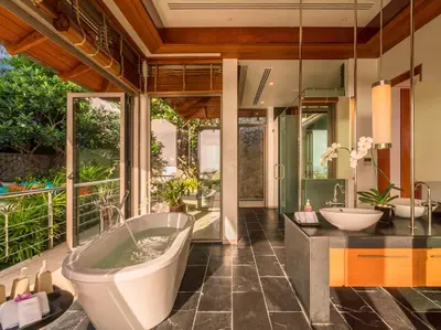 a bathroom with two sinks and a bath tub at Baan Paa Talee Estate - SHA Extra Plus in Kamala Beach