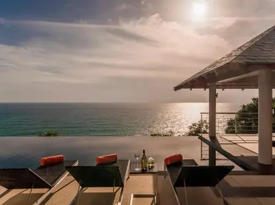 a view of the ocean from a swimming pool at Baan Paa Talee Estate - SHA Extra Plus in Kamala Beach