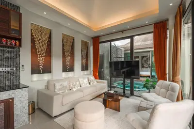 a living room with white furniture and a flat screen tv at V232 Private 4BR Pool Villa Near Big Buddha&Gym in Chalong