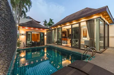 a swimming pool in front of a villa at V232 Private 4BR Pool Villa Near Big Buddha&Gym in Chalong