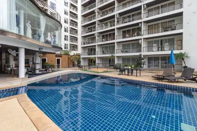 a large swimming pool in the middle of a building at C229 1BR Studio Sea View 850m to Beach Gym in Patong Beach
